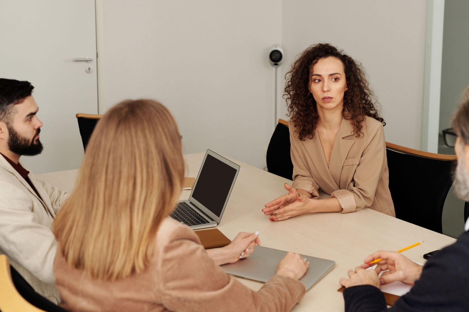Professionals reviewing a business question together